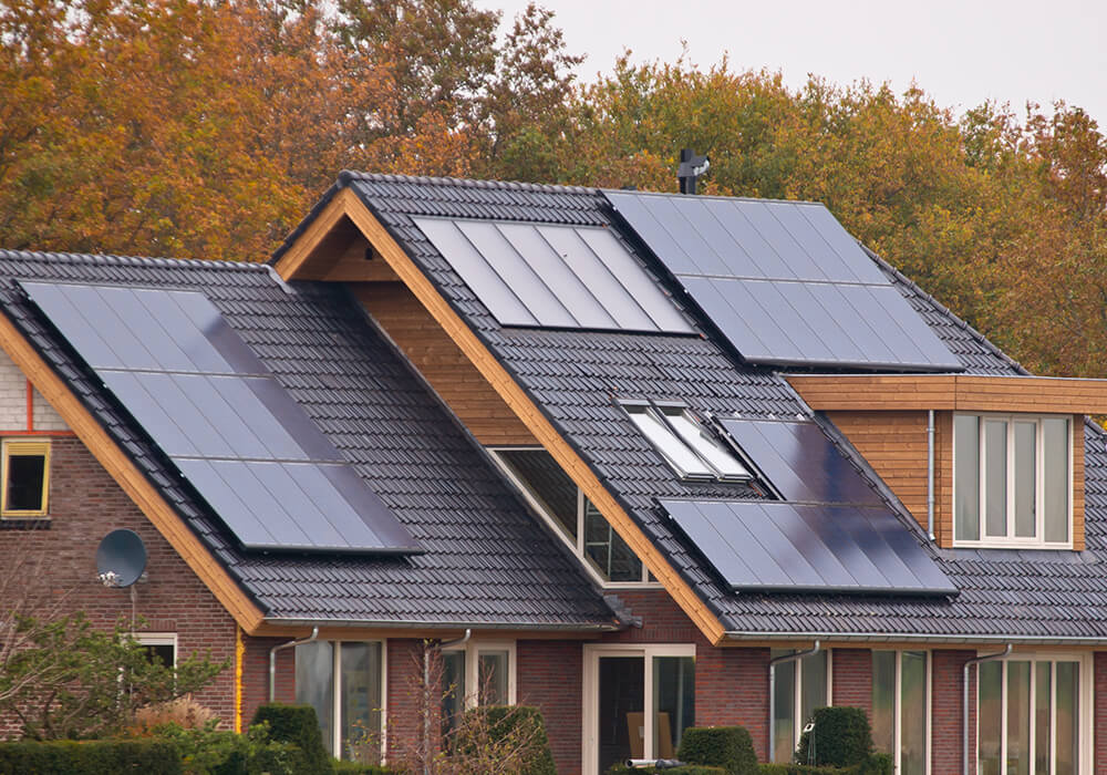 solar panels on roof of house in fall