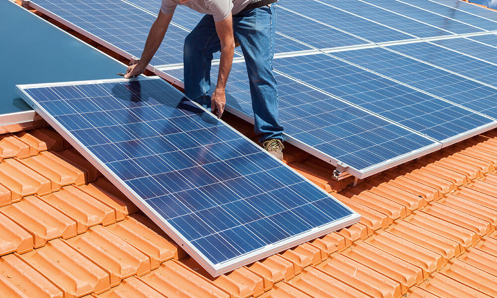 Man Installing Residential Solar Panels