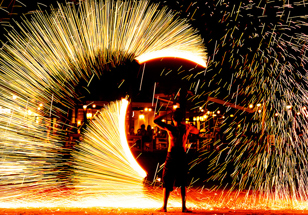 a performer displaying close range fireworks