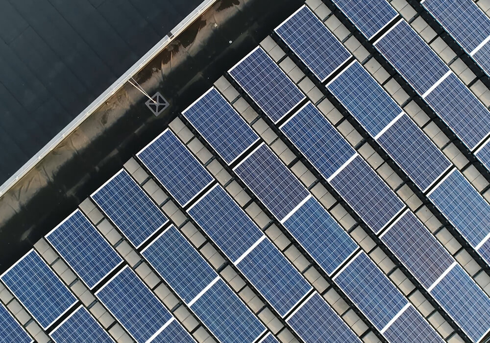 an overhead of a building with solar panels on top