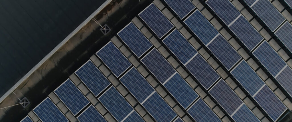 an overhead of a building with solar panels on top