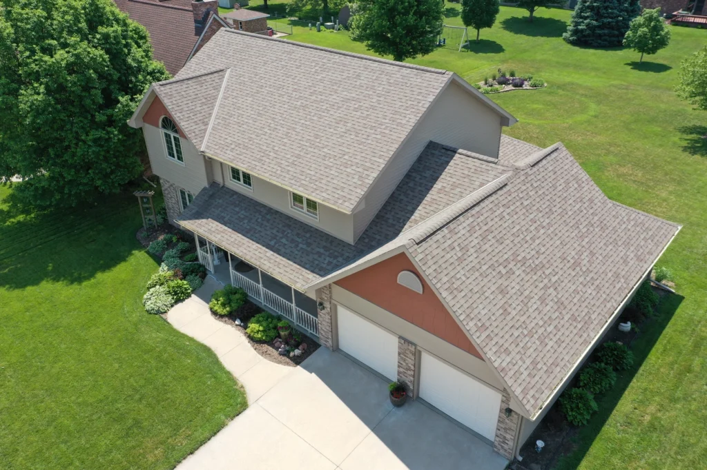 aerial view of shingle roofing system with new roof shingle installation after hail damage