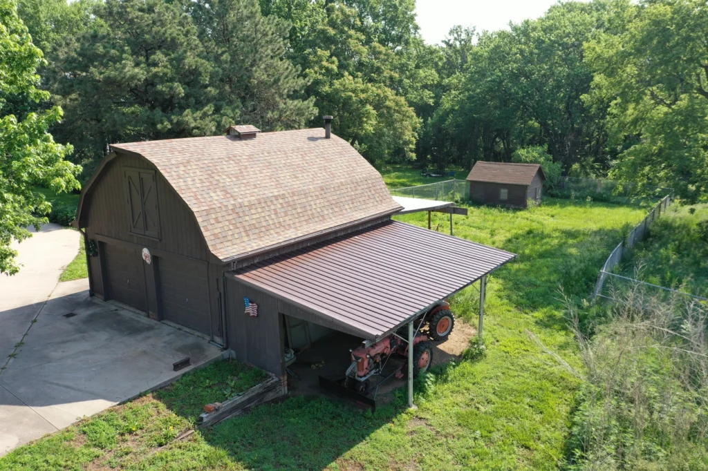 aerial view of brown asphalt shingle colors installed after roof leaks and storm damage in ralston ne