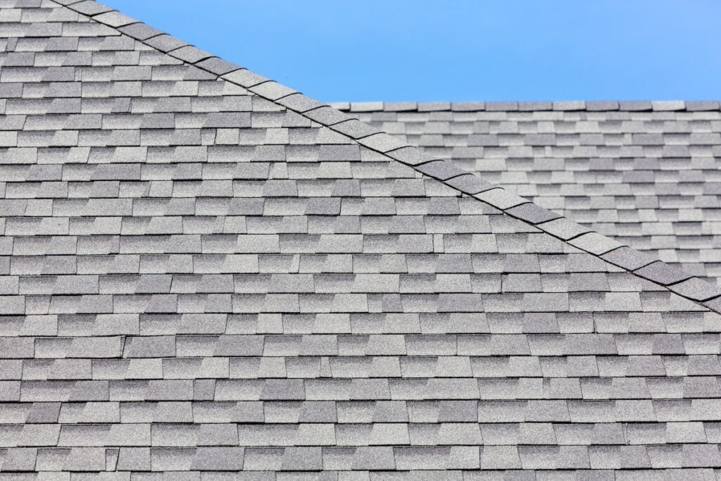Close up of new asphalt shingles installed on roof