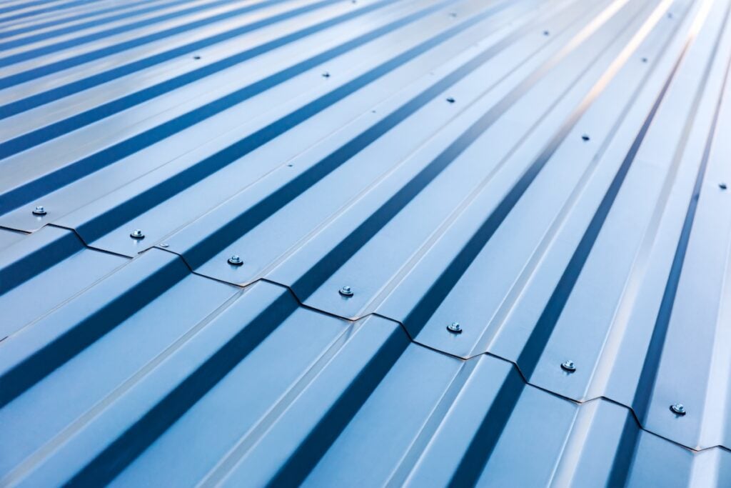 blue corrugated metal roof with rivets, industrial