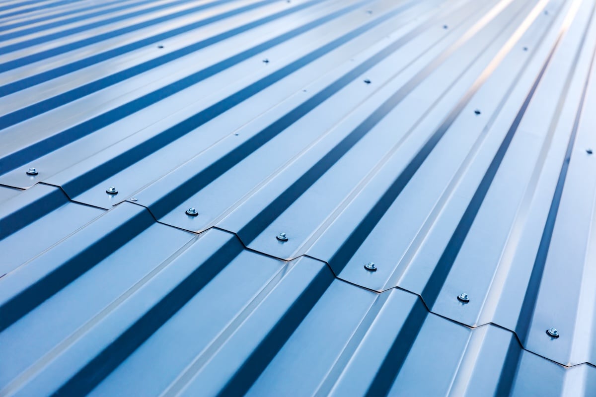 blue corrugated metal roof with rivets, industrial