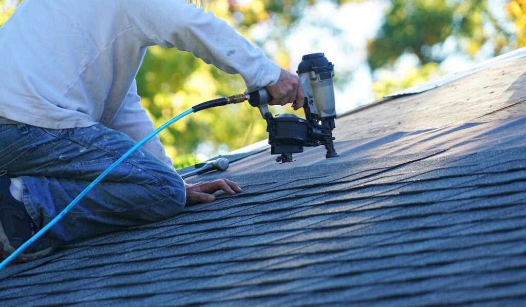installing shingles on roof professional