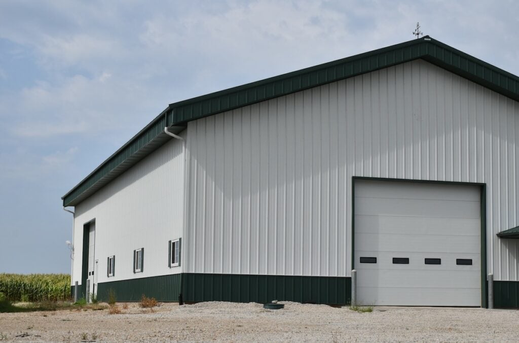 metal siding on barn building with garage doors