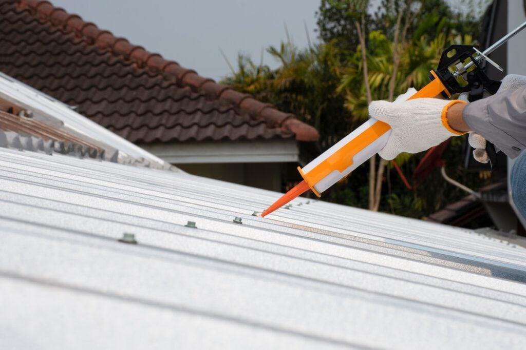 Glue gun sealing metal roof
