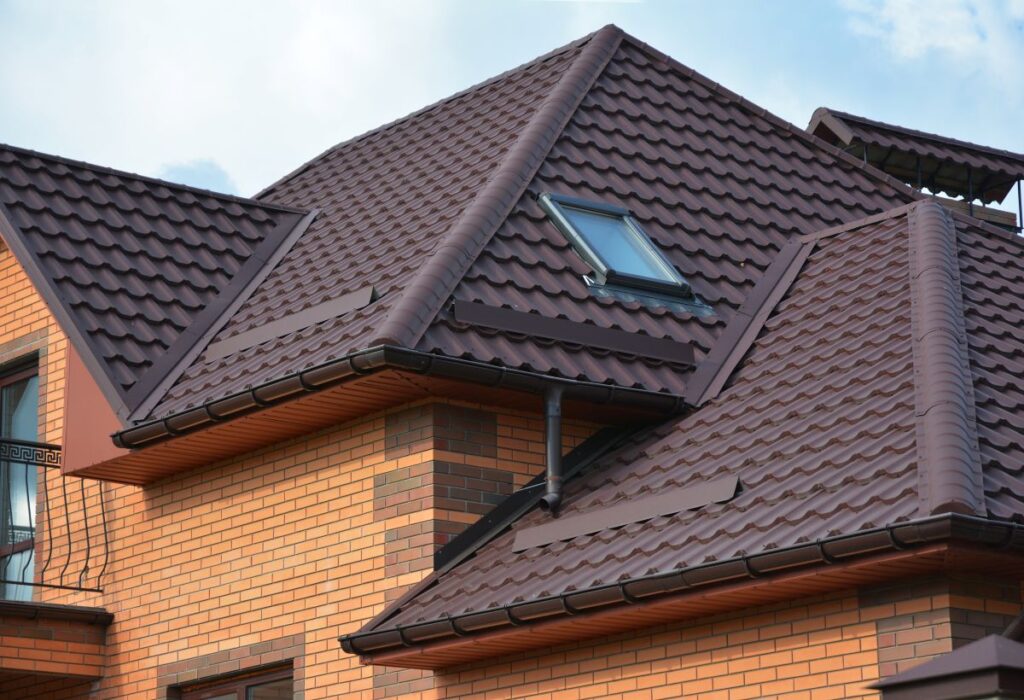 brown metal tile roof on a brick house