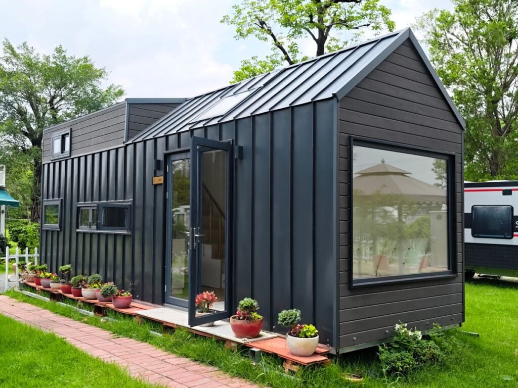 can you paint metal siding small black house
