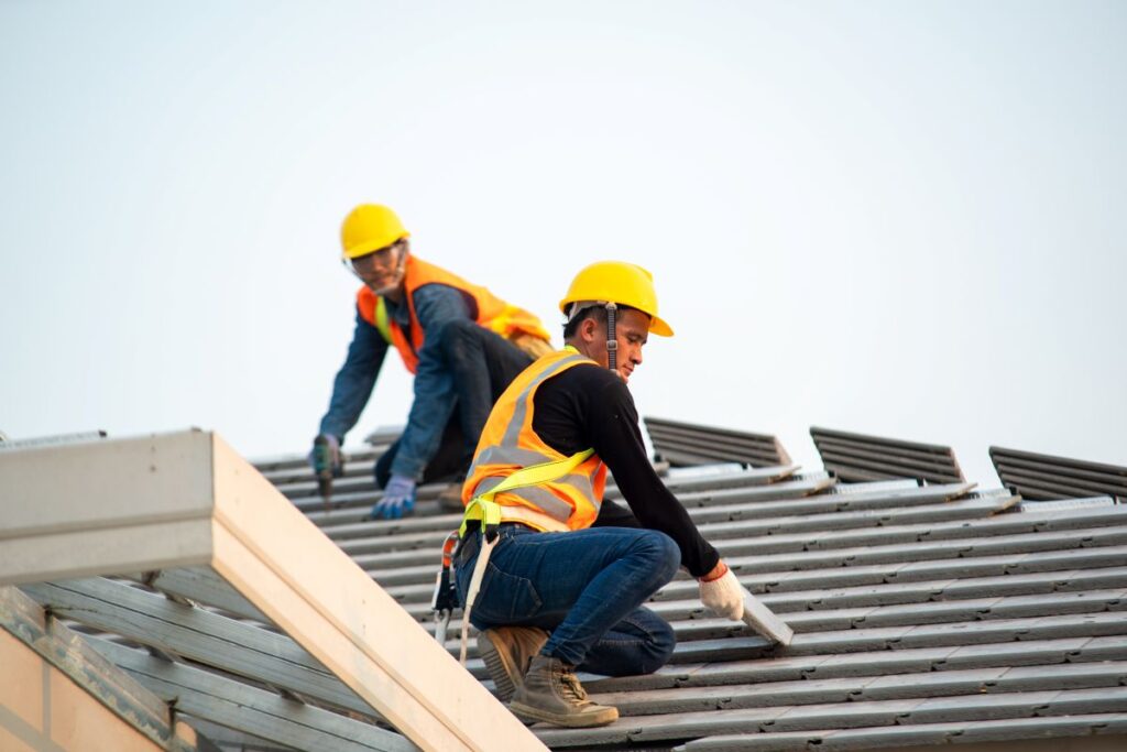 do you need to close your business during a roof replacement workers replacing roof