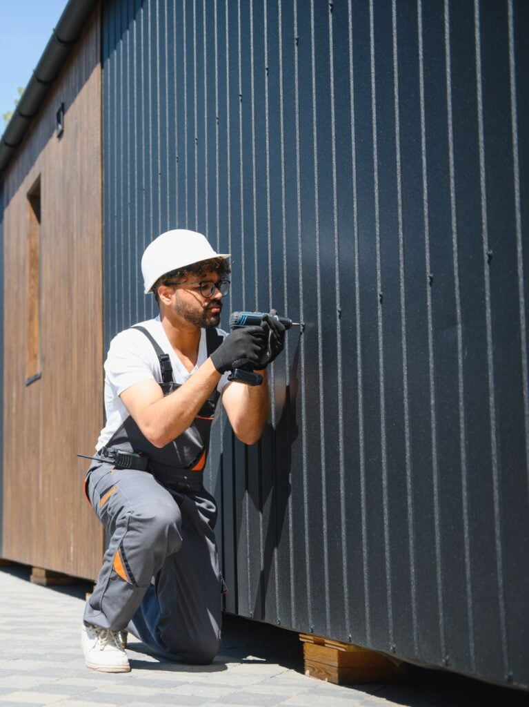 how to install metal siding worker using tool panels