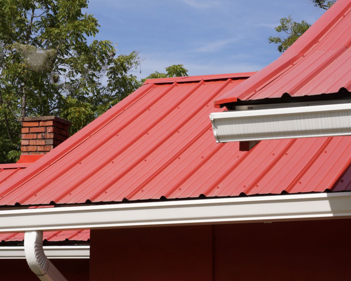 metal roof retrofit orange white gutter system