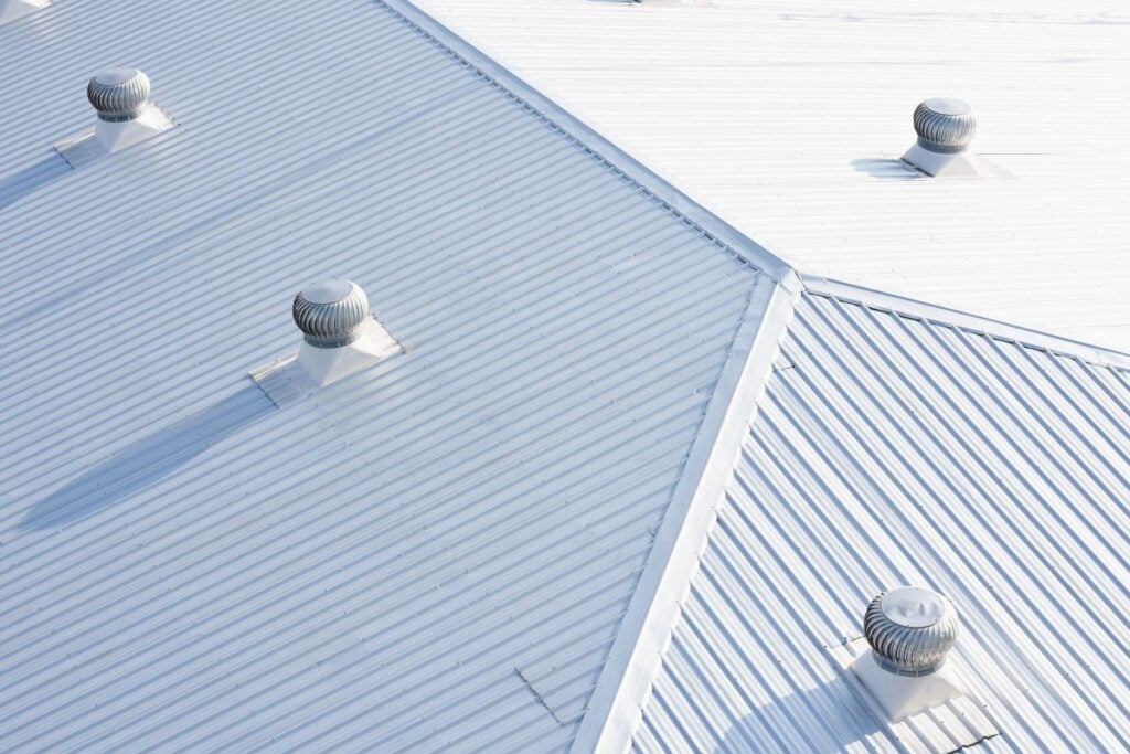 metal sheet roofing on commercial construction with blue sky