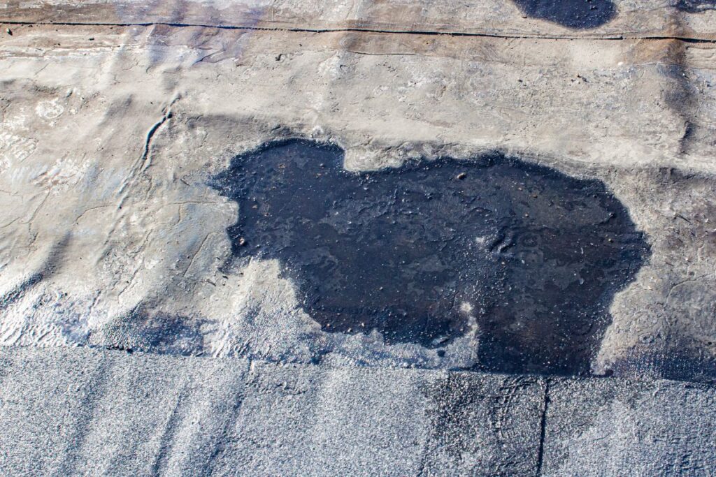 water ponding on a commercial flat roof