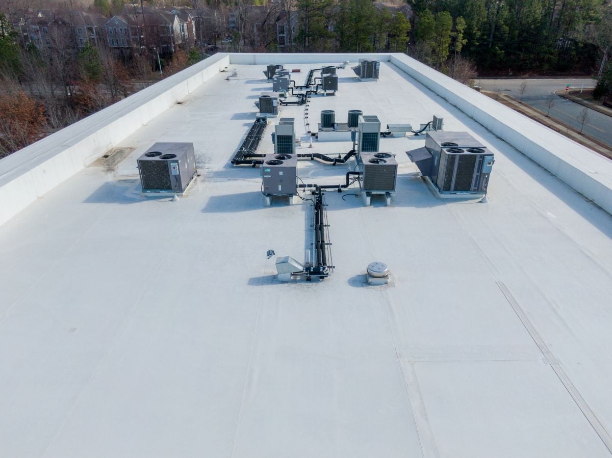 white flat commercial roof with TPO