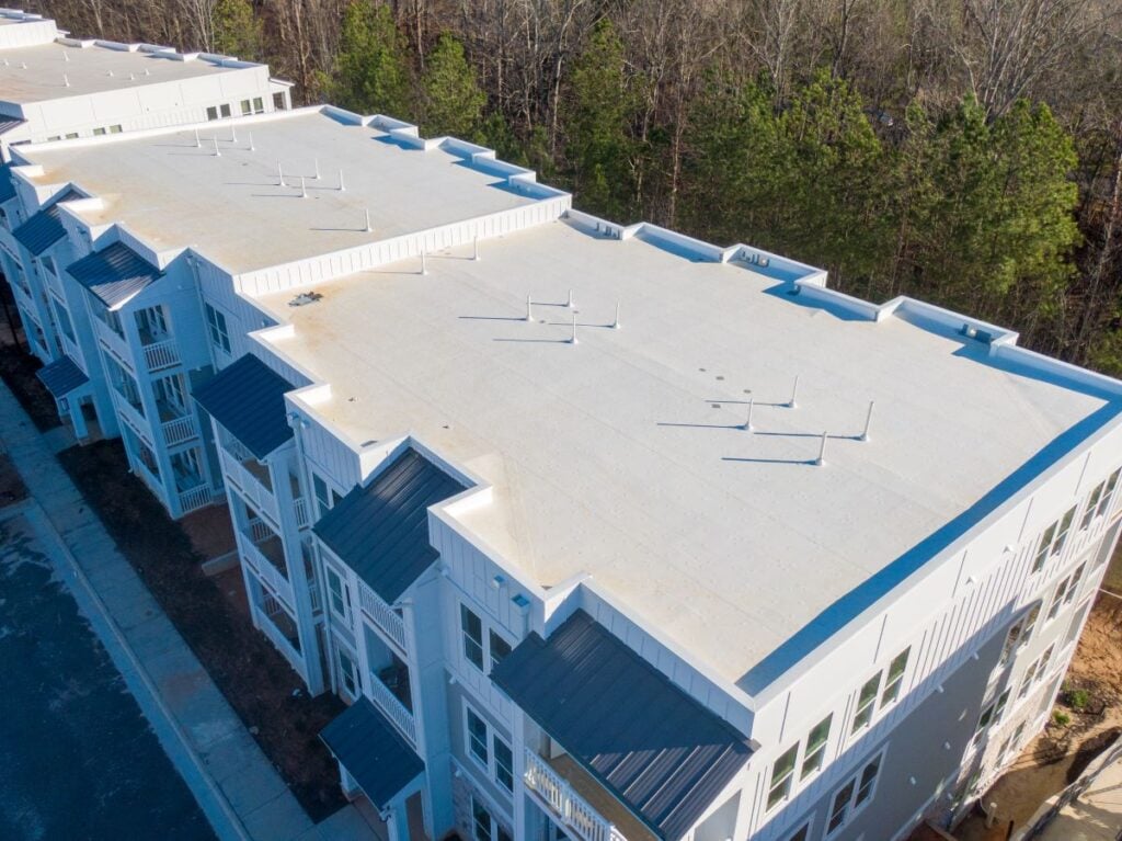 white flat roof of apartment buildings