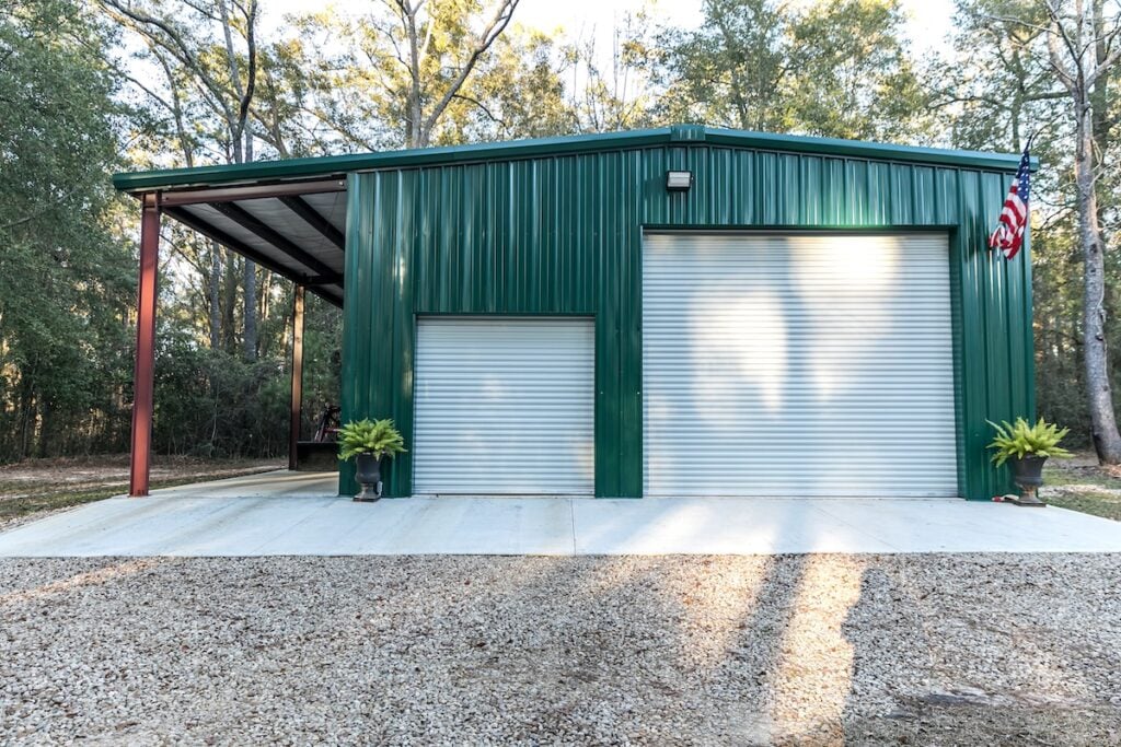 Large green outdoor metal building 