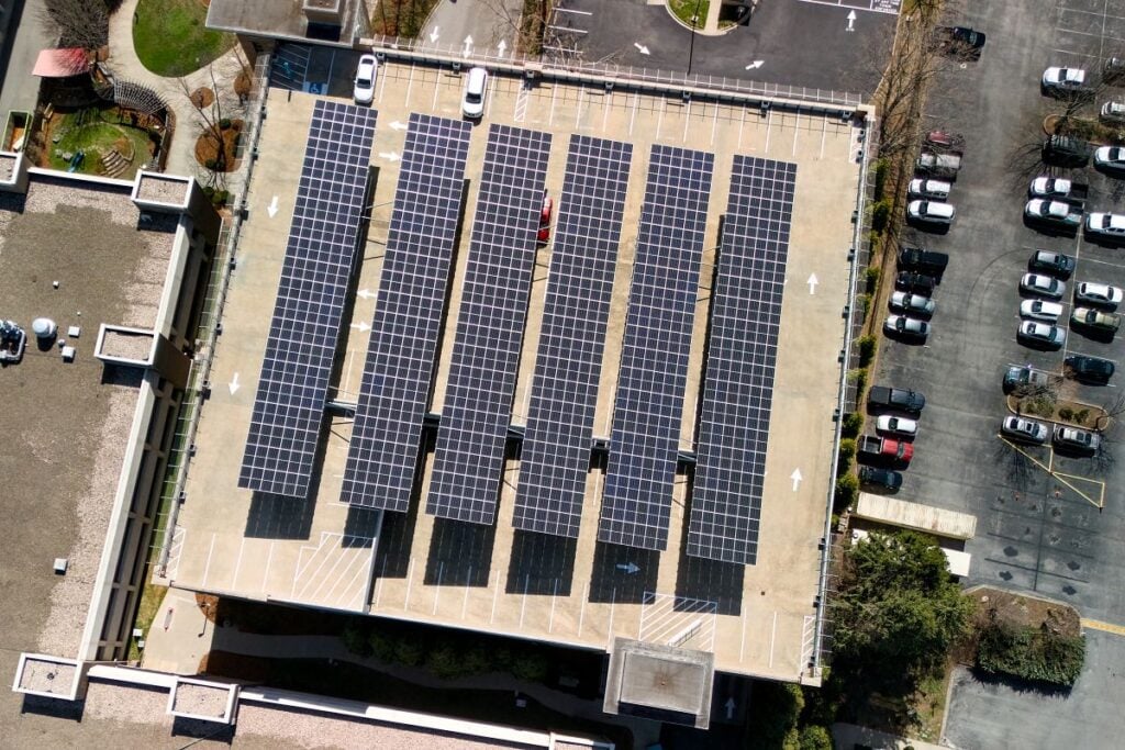 commercial solar installation aerial view of panels on a building