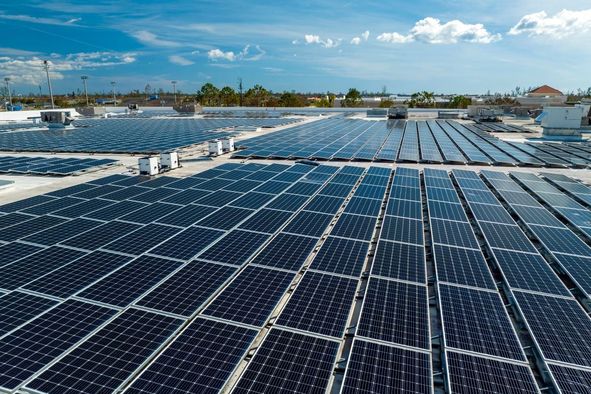 commercial solar installation panels on top of building