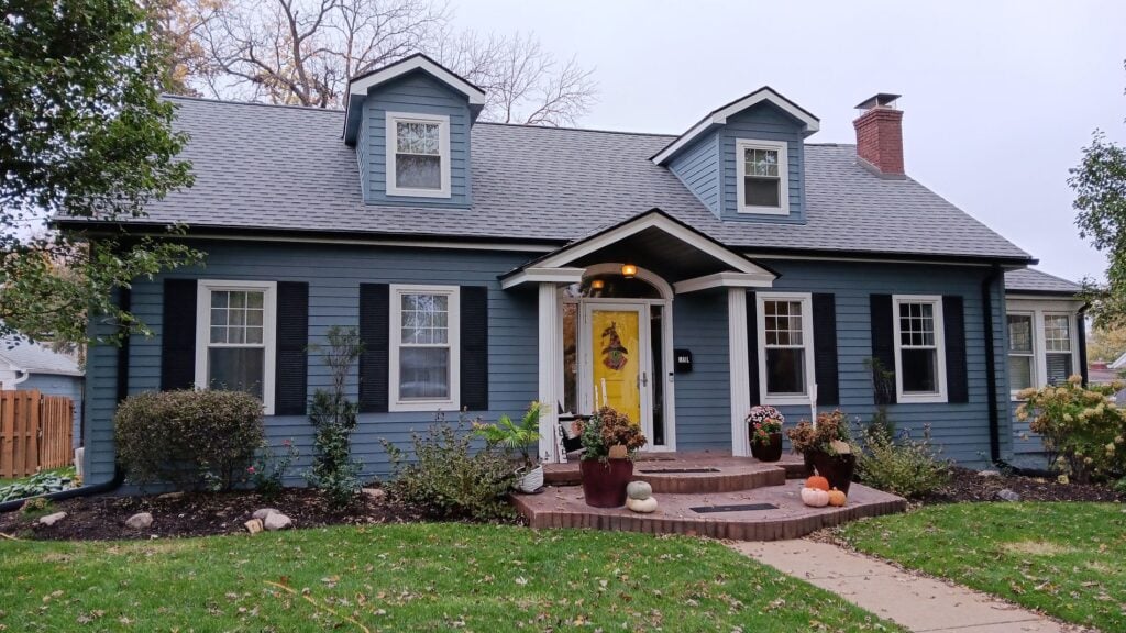 roof replacement financing blue house winter time