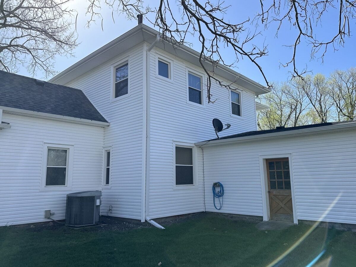 fiber cement siding vs vinyl white siding big house small wooden door