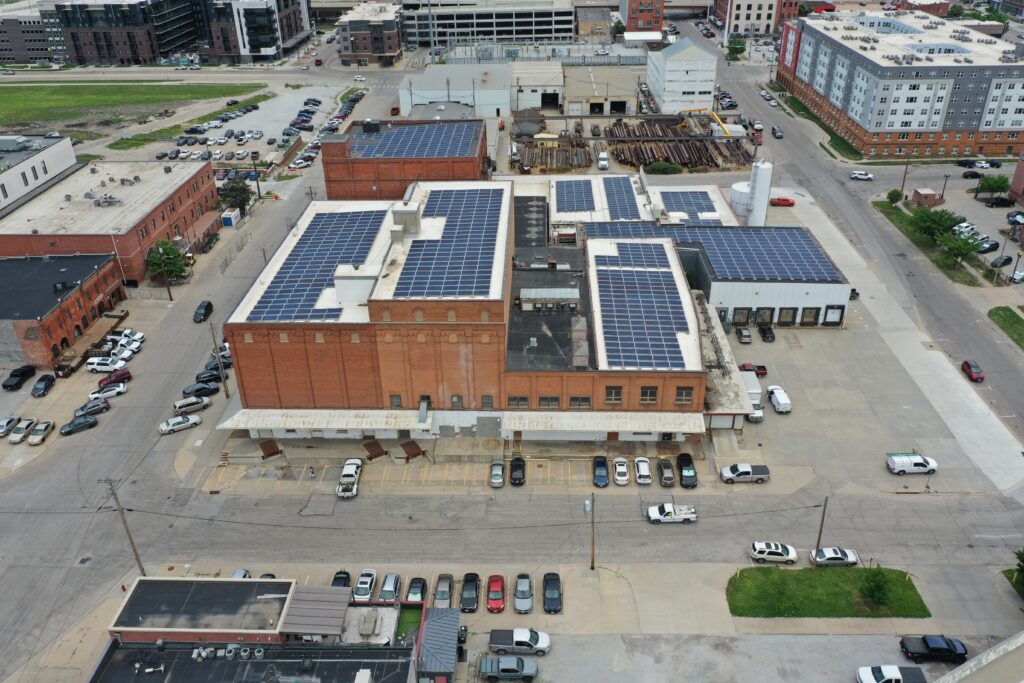 commercial solar tax credit big building aerial view cars outside parked