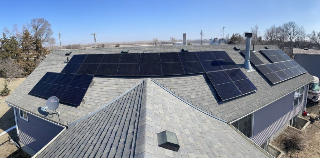 commercial solar tax credit big building aerial view grey shingles roof