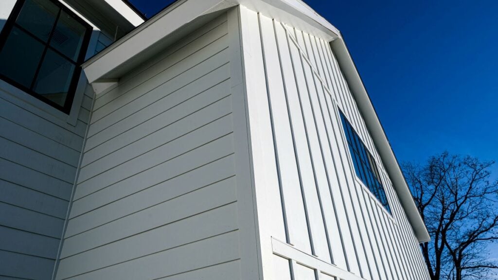 fiber cement siding vs vinyl white cement siding blue sky
