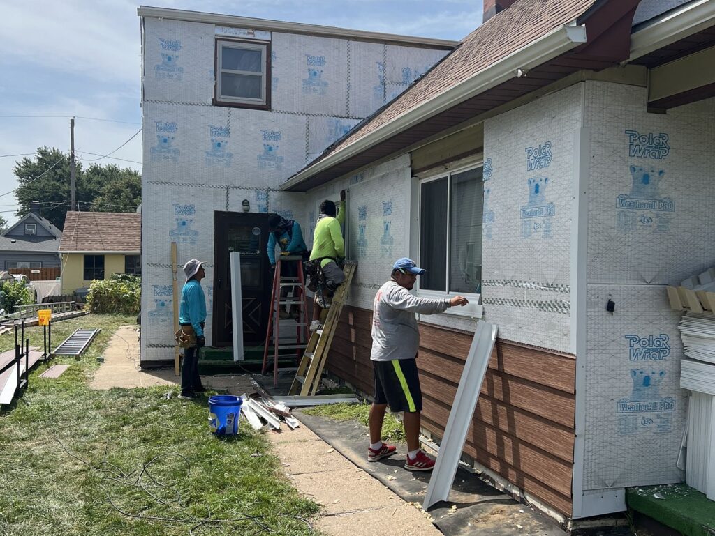 siding colors for house workers installing new brown siding